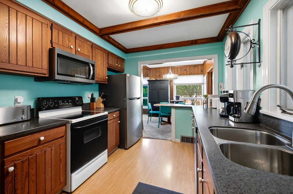 A fully equipped kitchen makes vacation meals easy, with the dining room just steps away