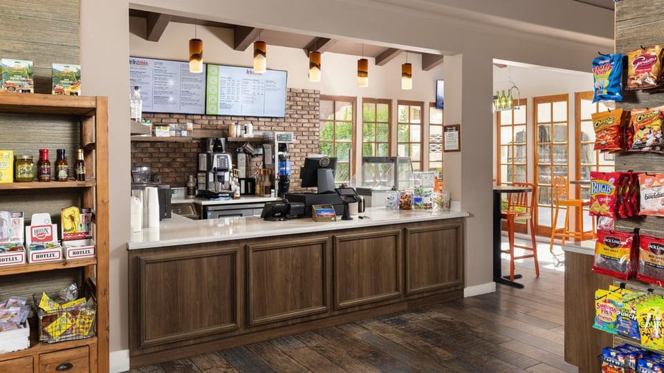 Grab a refreshing drink and snack while soaking up the vibrant atmosphere in this cozy café.