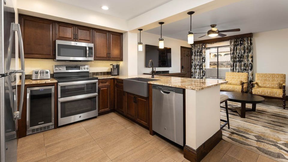 Cook and gather in this beautiful kitchen, complete with stainless appliances and inviting seating.