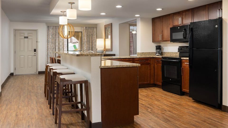 Cook with ease in this spacious, fully equipped kitchen featuring modern appliances.
