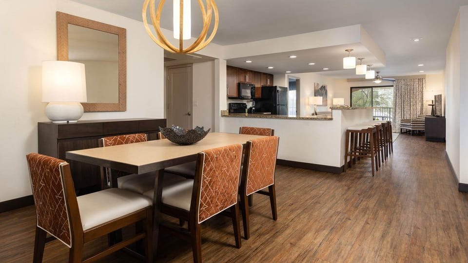 Gather around the dining table for meals or evening games with family and friends.