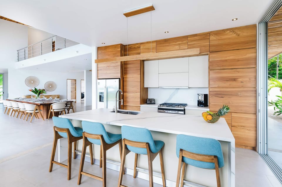 Bright, contemporary kitchen with island seating.