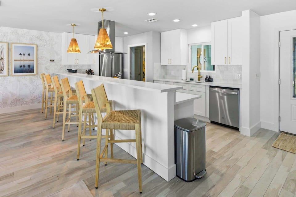 Sleek counters, stainless appliances, and seating for the whole crew!