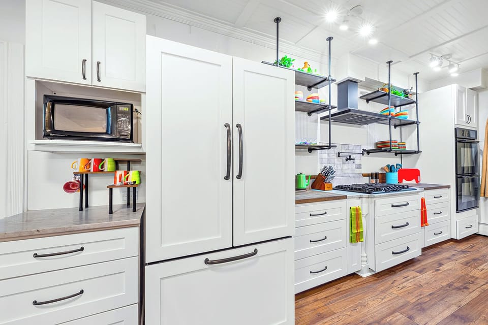 Chef's kitchen with large fridge, 5-burner stove, and everything you need