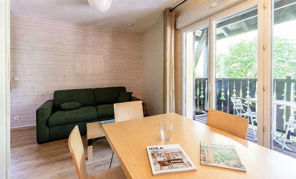 Glass doors open the living area to mountain air, just steps from the Ax-Bonascre lift year-round.