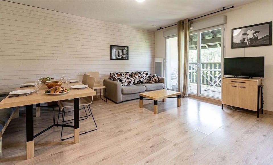 The living area's dining table is where the group regroups after a day on the mountain, winter or summer.