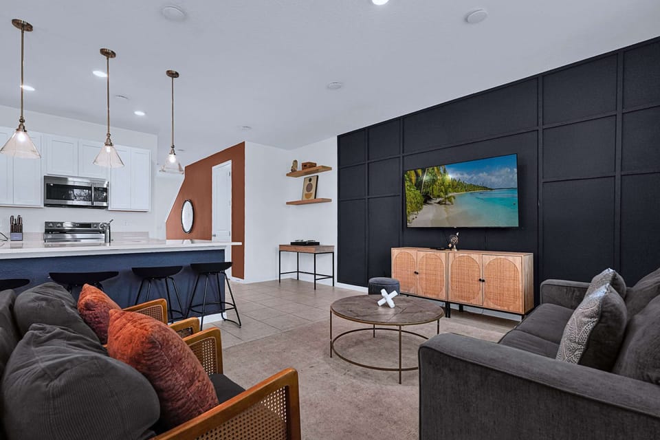 Living room featuring a Smart TV, cozy seating, and entertainment space for guests