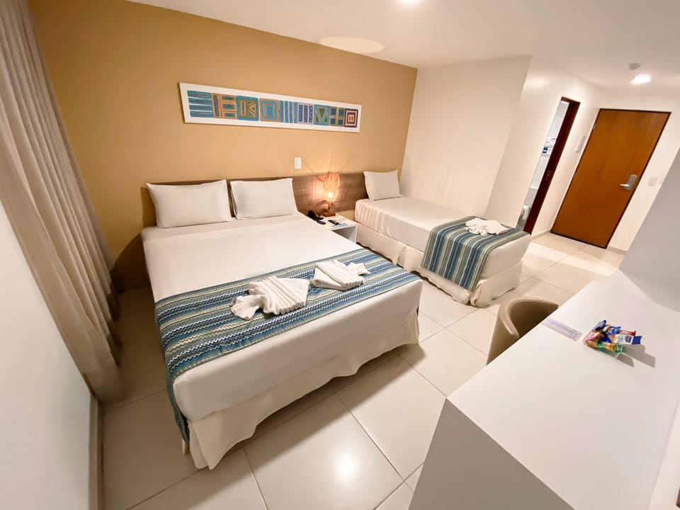 Standard Triple Room | Minibar, in-room safe, desk, free WiFi