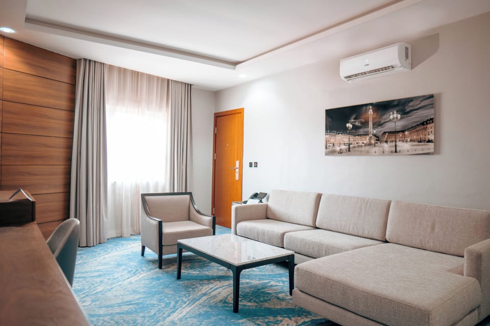 Executive Suite | Living area | 55-inch LED TV with cable channels