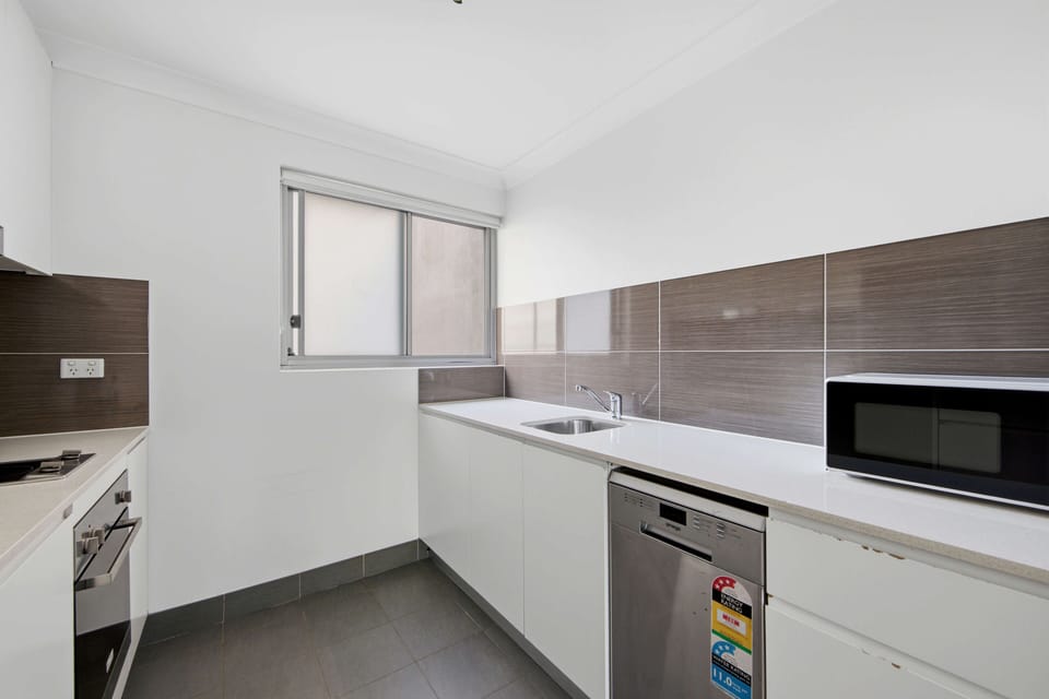 Kitchen with stovetop, oven, sink and ample cabinetry
