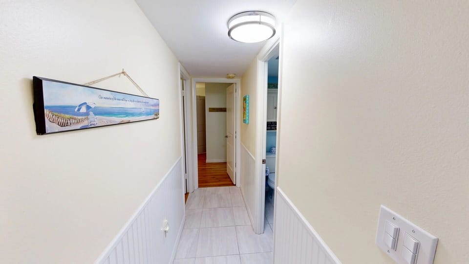 Hallway that leads to the shared bathoom, guest bedroom and master bed/bath area.