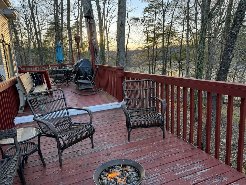 Upper deck seating, gas fire pit, and a seasonal winter view