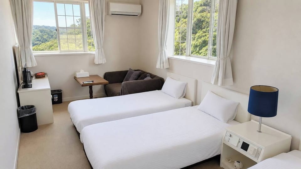 Basic Triple Room, Ocean View | Laptop workspace, WiFi (free), bed sheets