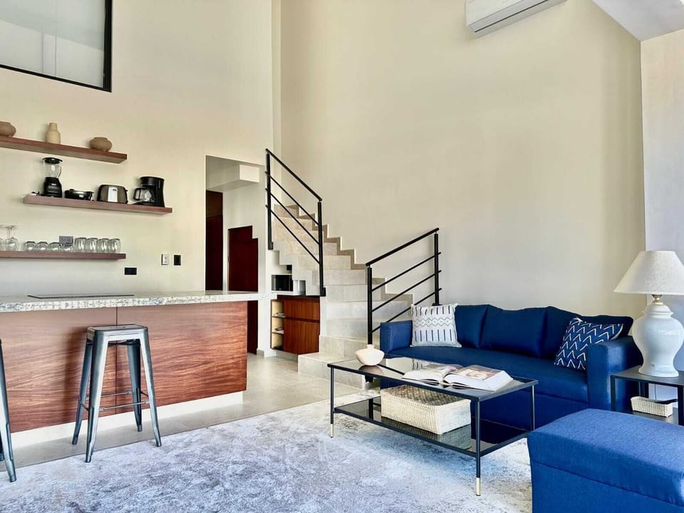 Living room and kitchen with staircase to upper floor