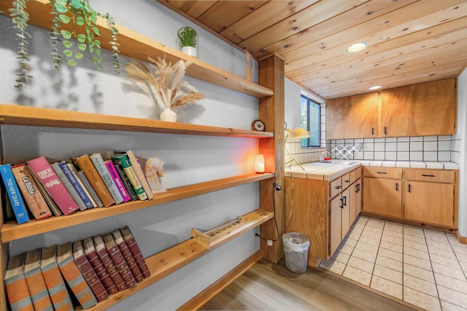 A cozy reading nook and built-in shelving add character and charm to the home