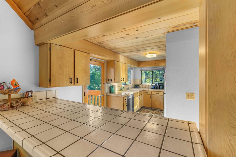 The fully equipped kitchen offers plenty of space to prepare meals for family and friends