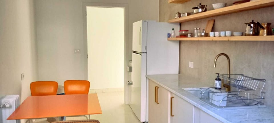 Comfort Apartment, City View | Private kitchen | Coffee/tea maker, full-size fridge, microwave, oven