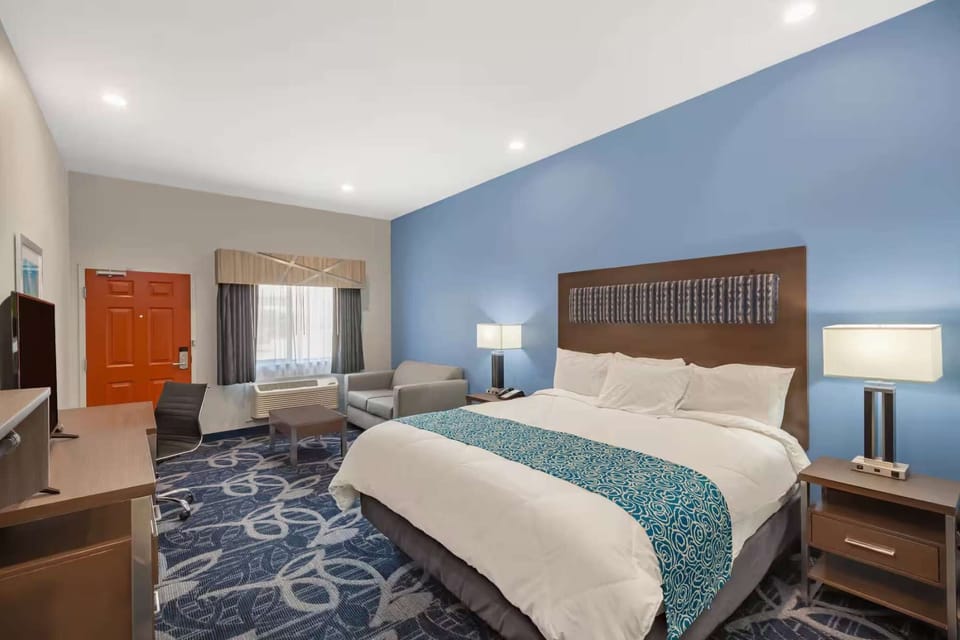 King bed with seating area and window light