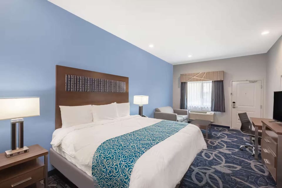 Spacious king room with desk and lounge chair