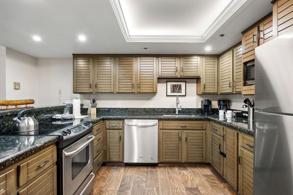 Prepare everything from quick breakfasts to family dinners in the fully equipped kitchen featuring stainless steel appliances, ample cabinetry, generous counter space, and all the essentials for cooking at home.
