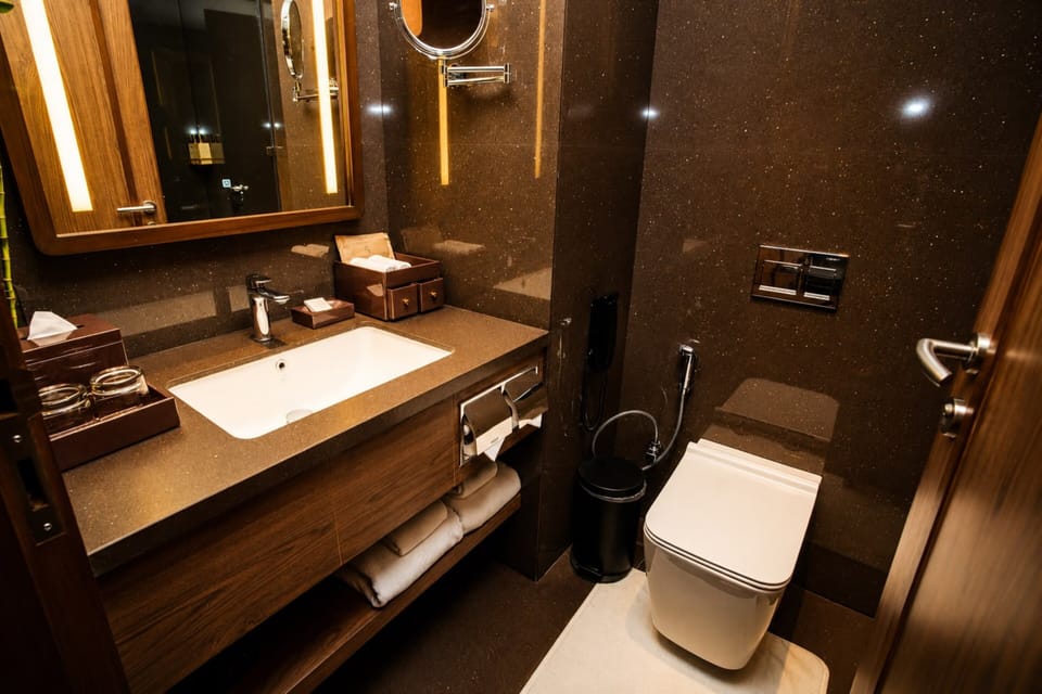 Shower, hair dryer, slippers, towels