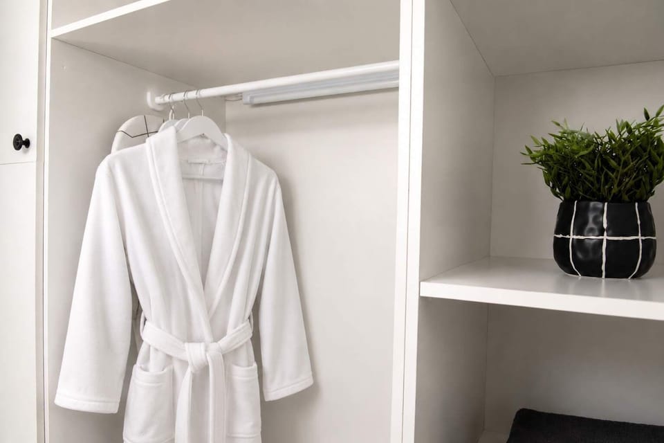 Apollonas - Practical wardrobe space with robes and storage for a comfortable stay.
