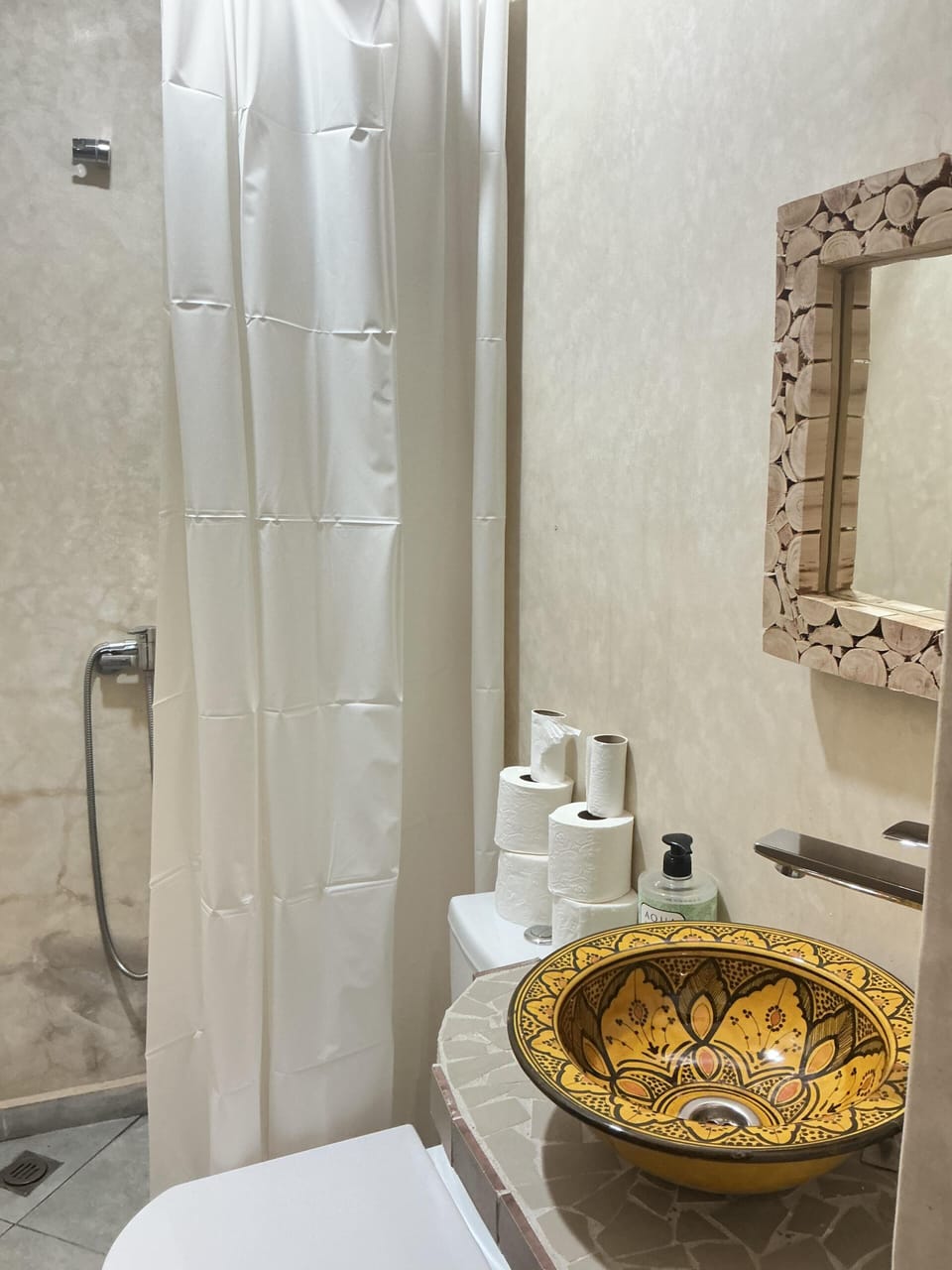 Shower, towels, soap, toilet paper