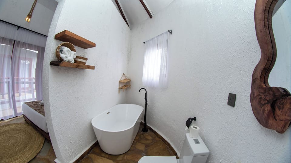 Separate tub and shower, free toiletries, hair dryer, slippers