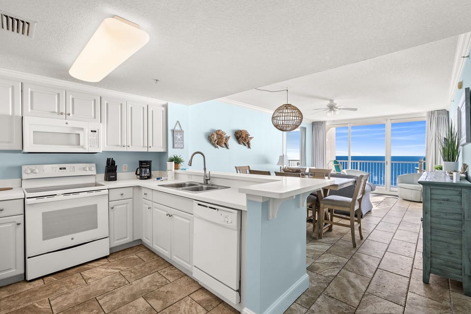 Open kitchen and dining area with ocean views and natural light
