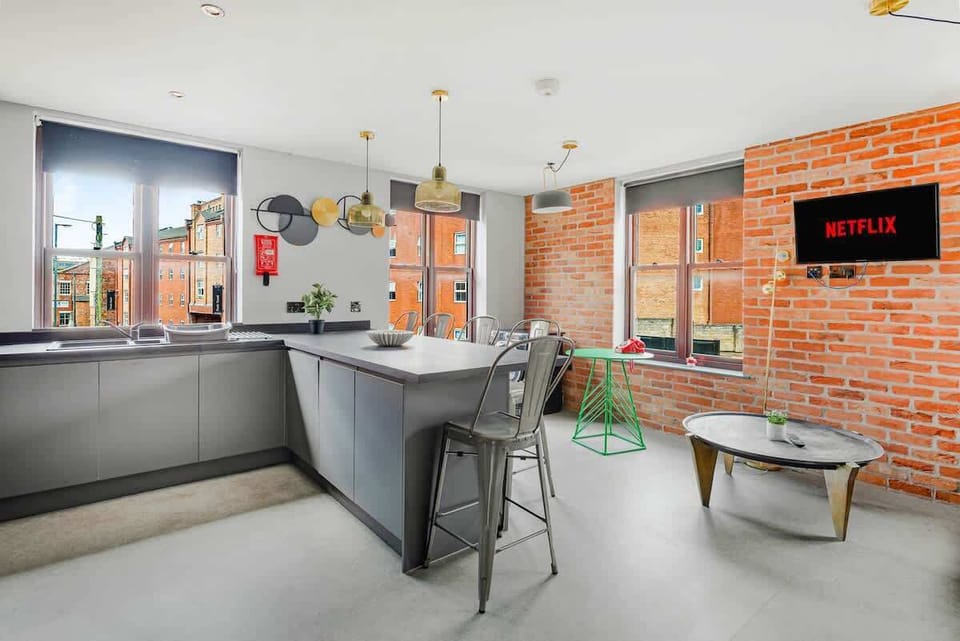 Modern kitchen with pendant lighting - stylish self-catering space at this 6 bedroom house Derby, hosted by Sahara Suites.