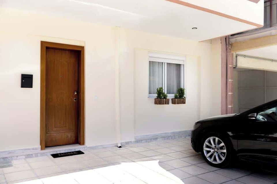 View of the entrance of the property and the private parking 