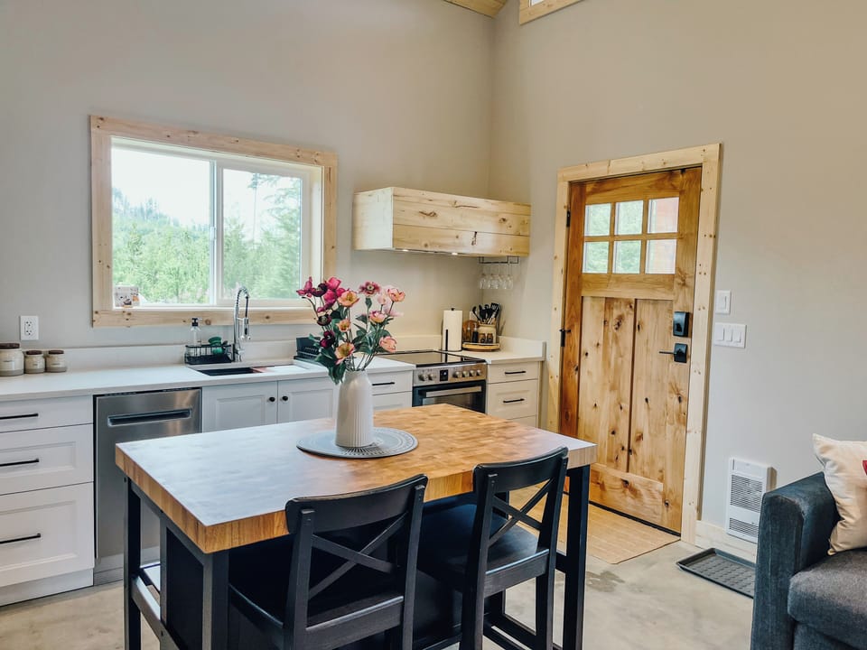 Butcher block island with 2 stools