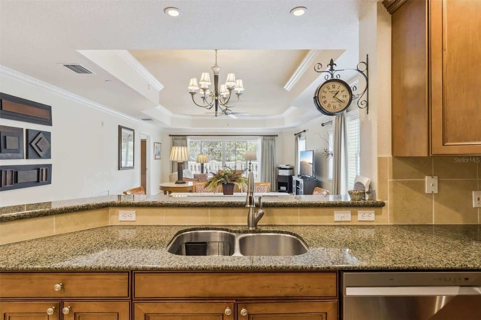 Granite countertops, stainless appliances, and plenty of workspace make cooking together part of the vacation.