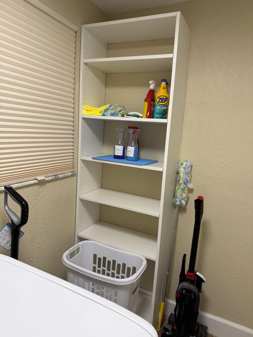 Laundry Room located in hall with detergent and softener provided