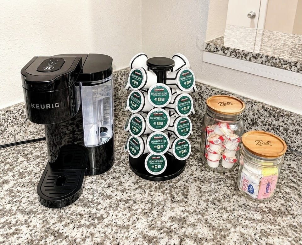 Keurig Coffee Maker, 35 Keurig Pods, and an Assortment of Creamers and Sugars