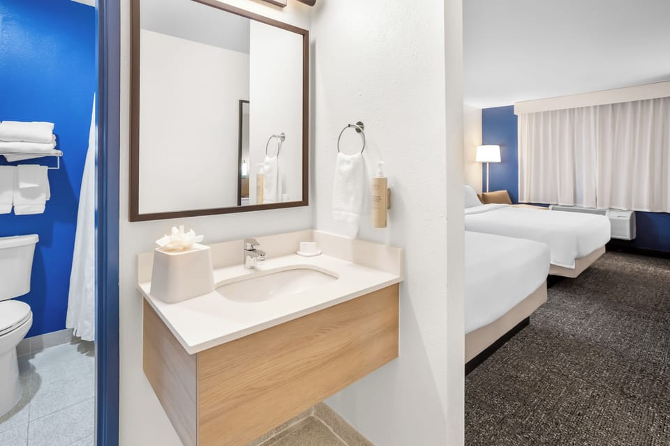 Room, 2 Queen Beds | Blackout drapes, iron/ironing board, free WiFi, bed sheets
