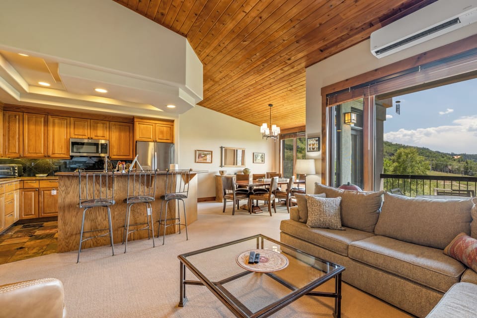 Bright, open-concept living area with seamless kitchen and dining access