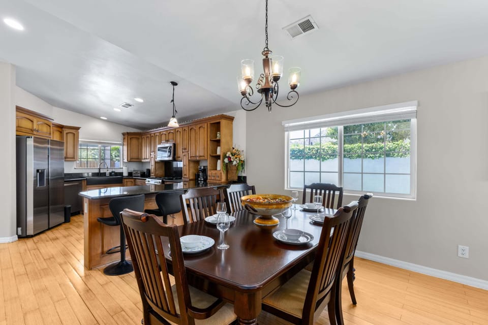 Dining table and chairs for 6 guests. Additional seating for 4 guests at kitchen counter.