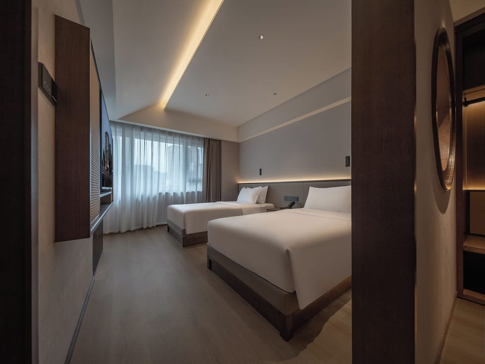 Premium bedding, down comforters, memory foam beds, minibar