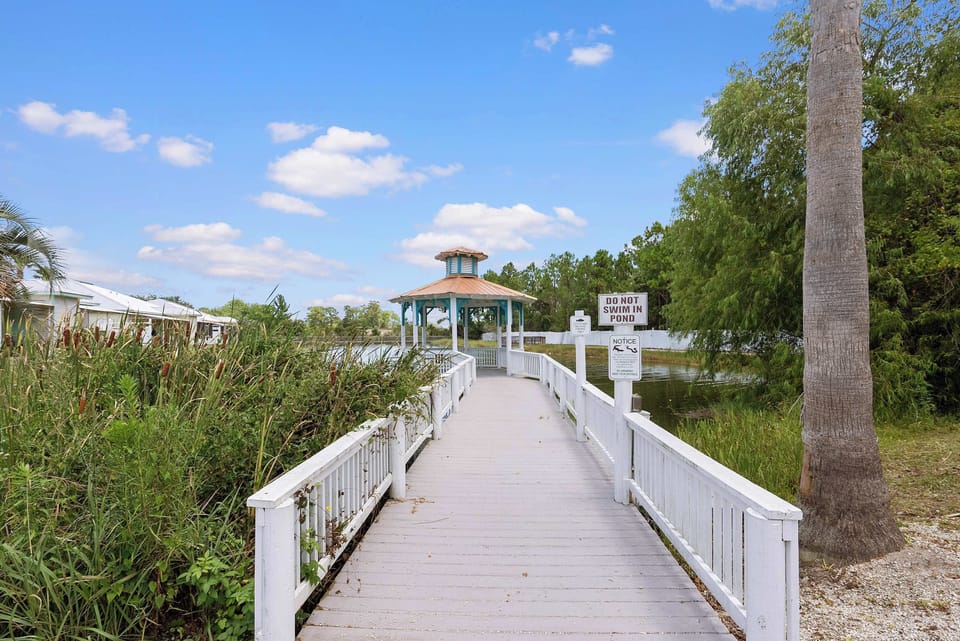 Community boardwalk leading to the pondside gazebo. Swimming in the pond is not permitted.