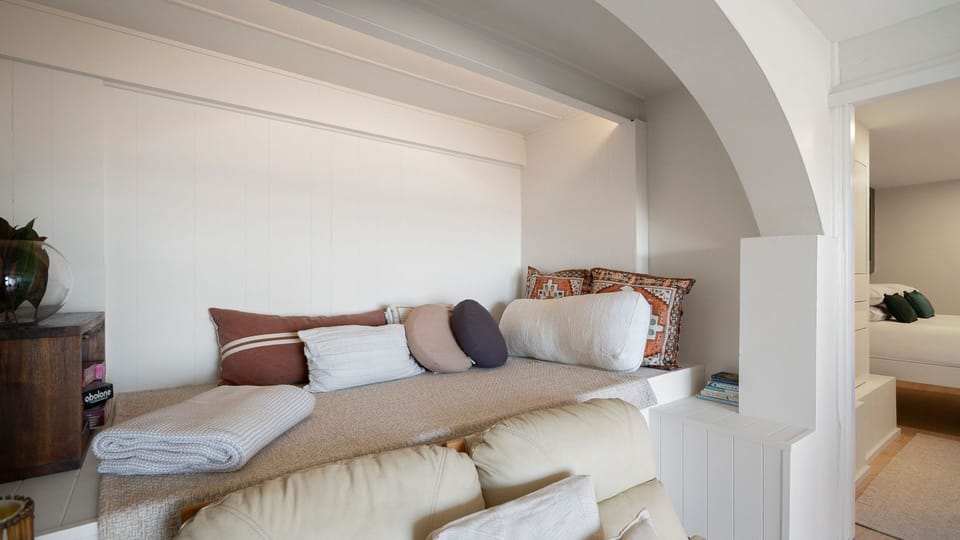 A built-in daybed offers the perfect spot to curl up with a book or enjoy a quiet moment.