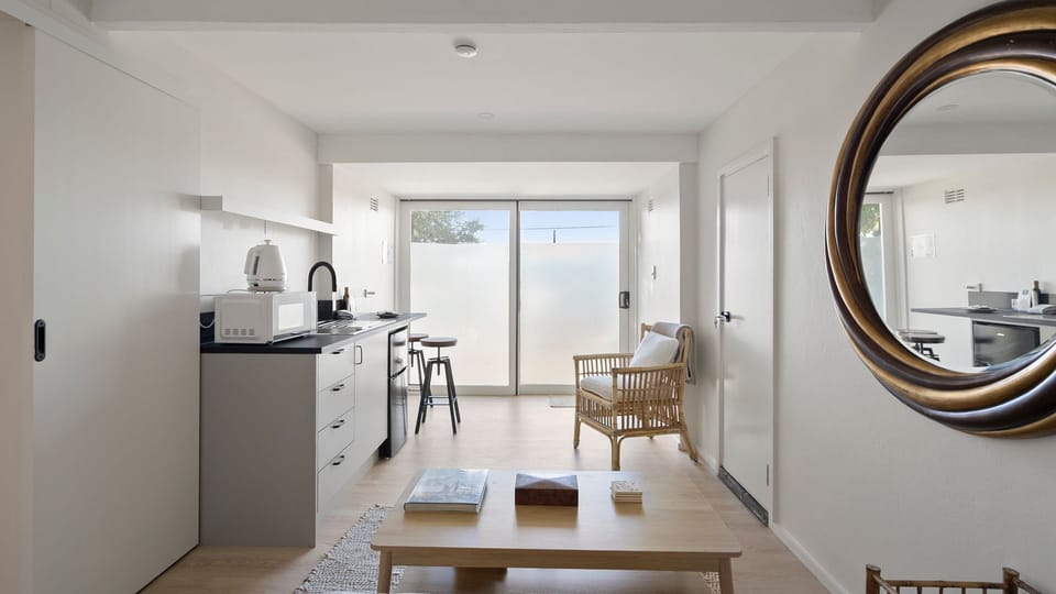 The open-plan layout creates a seamless flow from the kitchen to the living area.