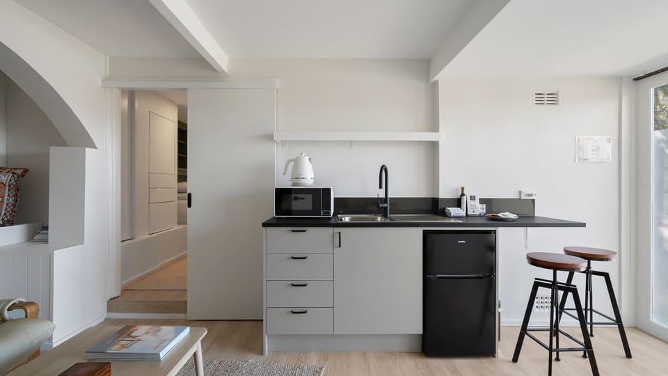 A thoughtfully designed kitchenette provides everything you need for effortless meals.