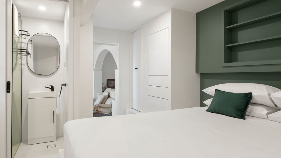 Wake up refreshed in a calming bedroom with smart storage solutions.