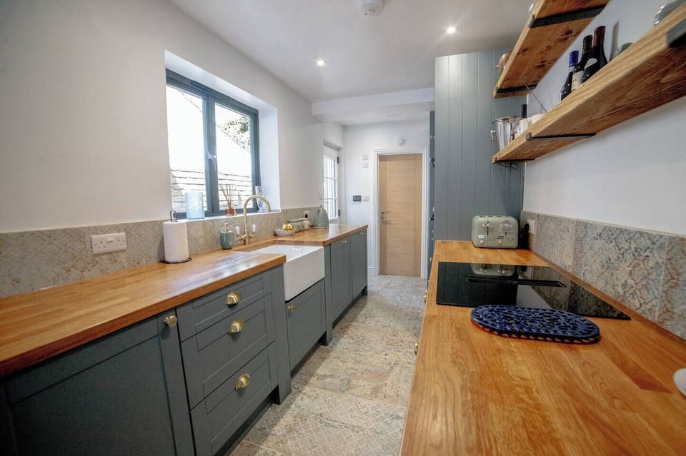 Open plan space consisting of living room, dining room and kitchen.