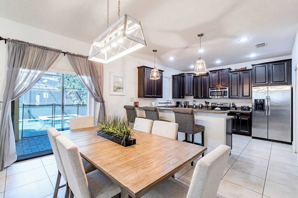 Full kitchen will all cooking and dining essentials. Open floor plan provide tons of space for everyone to be together. 8 top dining table, bar seating and huge sectional couch!