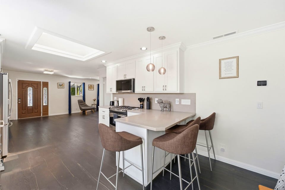 Bright modern kitchen with island seating and airy open layout