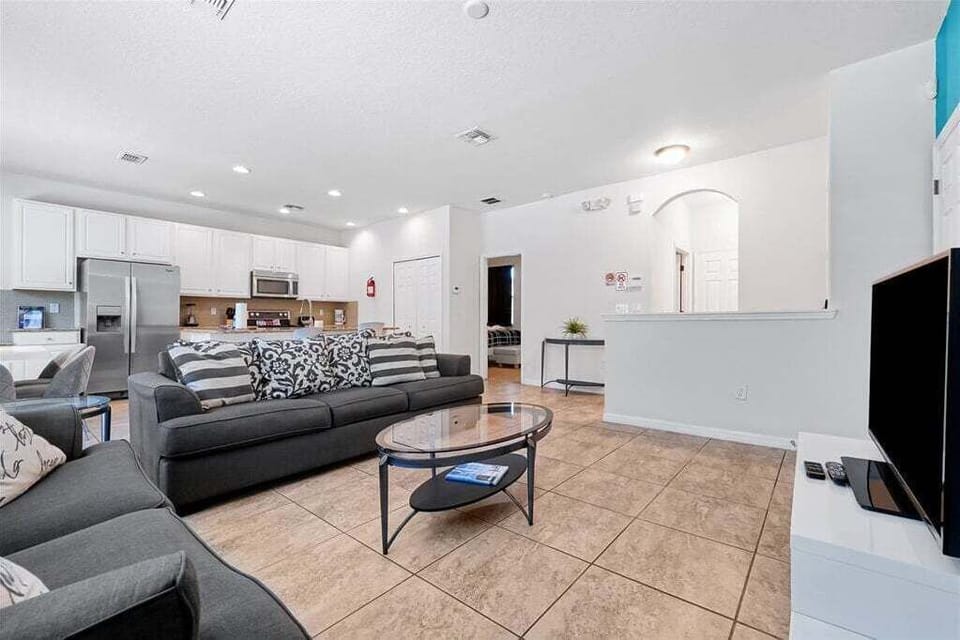 Relax together in the bright, open living area that flows seamlessly into the kitchen. The perfect space for movie nights, family gatherings, and planning your next adventure.