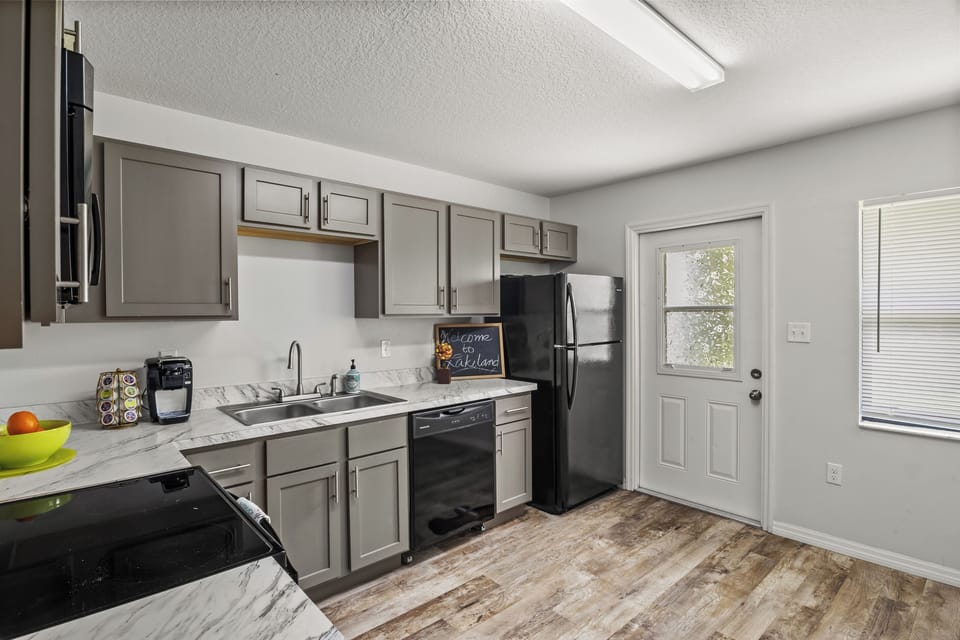Kitchen connects to the Backyard door.