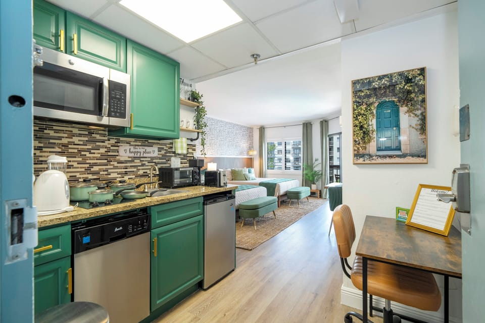 Stylish and cozy studio featuring a fully equipped kitchen, a plush King bed, a comfortable living area, and a private balcony. The perfect place to relax and recharge after an exciting day at the parks.